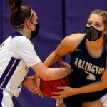 Lake Stevens' Melanie Delestrez (left) and Arlington's Abby Schwark tangle up for a jump ball Wednesday evening at Lake Stevens High School on June 9, 2021. (Kevin Clark / The Herald)