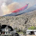 A plane drops fire retardant on the Palmer Mountain Fire last summer in north-central Washington. Laura Knowlton/Sound Publishing staff photo