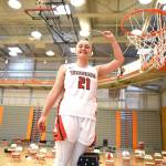Everett Community Colleges Mikail Montez, a Marysville Getchell High School graduate, helps cut down the nets following the Trojans 67-51 North Region championship-clinching victory over Bellevue on Saturday at the Walt Price Student Fitness Center in Everett. (Daniel Acosta / Everett Community College)