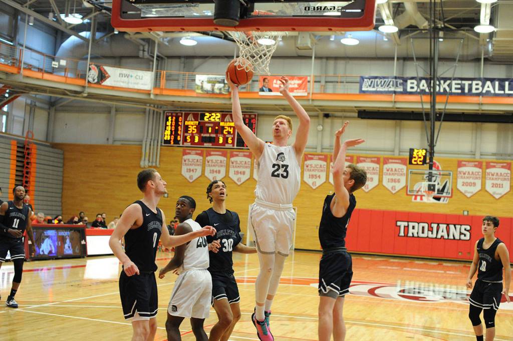 Everett Community College mens basketball player Devin Smith (23) goes up for a layup during the Trojans 70-64 victory over Bellevue, which clinched the NWAC North Division title for Everett, last Saturday at the Walt Price Student Fitness Center in Everett. (Daniel Acosta / Everett Community College)
