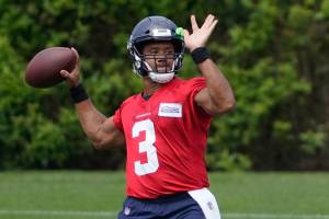 Seattle Seahawks quarterback Russell Wilson passes during NFL football practice Tuesday, June 8, 2021, in Renton, Wash. (AP Photo/Ted S. Warren)