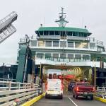 Passengers embark on the Tokitae ferry at the Mukilteo terminal in February. (Andrea Brown / Herald file)