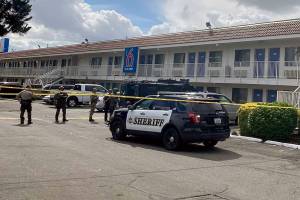 Officers surrounded a Motel 6 near Everett Tuesday morning after a reported rape. A man tried to flee but was subdued and arrested. (Ellen Dennis / The Herald) 20210615