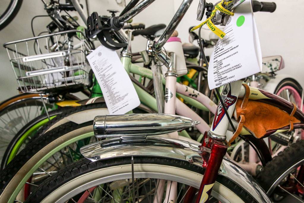 A collection of beach cruisers will be available for purchase during the garage sale at Sharing Wheels in Everett. (Kevin Clark / The Herald)