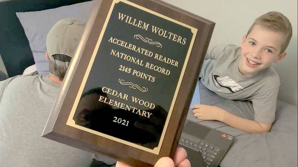 Willem Wolters National Accelerated Reader Award will be displayed at the Cedar Wood Elementary Schools library, from which many of the 380 books he read this school year were loaned. (Mark Smith)