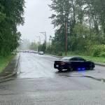 Police block a road while responding to a fatal shooting at the Colonial Gardens apartments in Lake Stevens on May 24. (Dakota Bair, file)