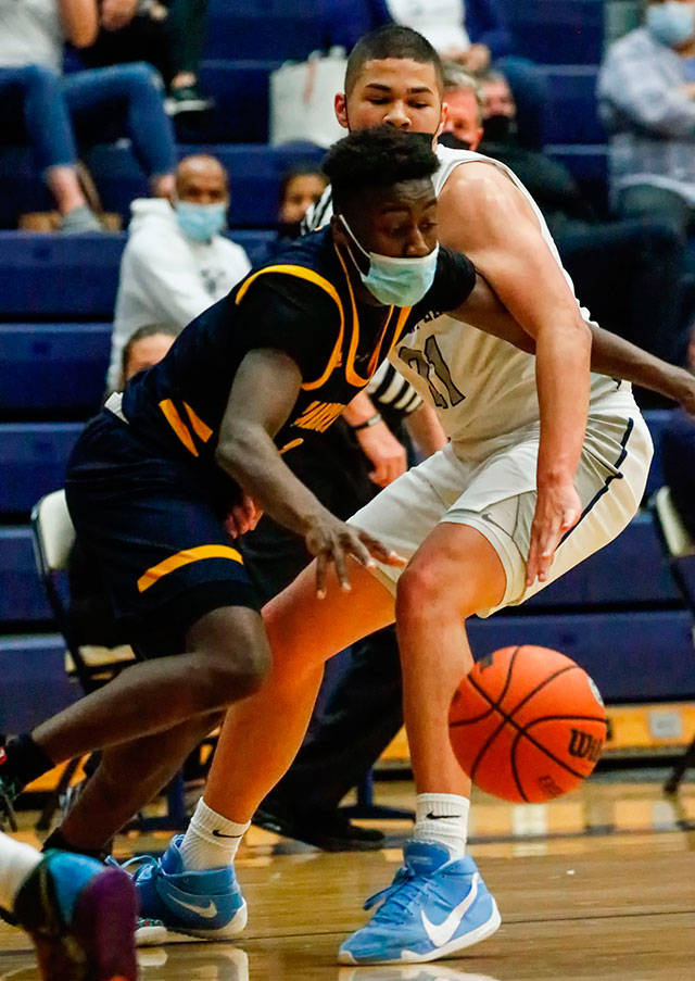Mariners Tijan Saine controls the ball with Glacier Peaks Torey Watkins defending during a game at Glacier Peak High School in Snohomish on May 27. (Kevin Clark / The Herald)