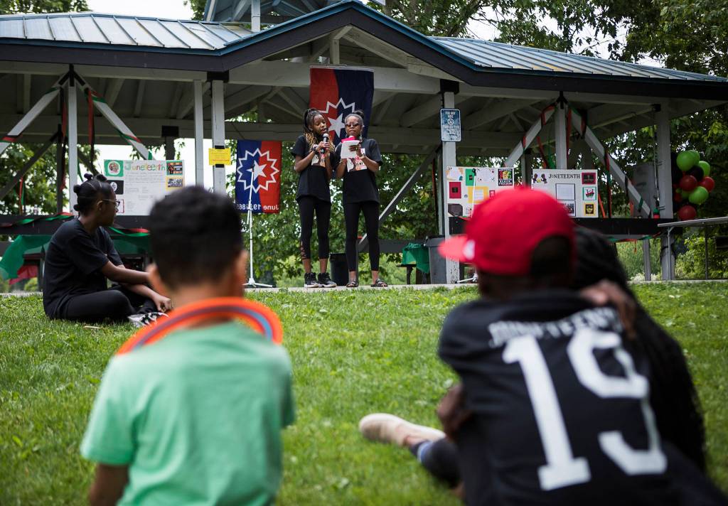 Junelle Lewis and her daughter Tamara Lewis, 15, perform a song together Saturday during the Justice to Jubilee Juneteenth Celebration at Skykomish River Park in Monroe. (Olivia Vanni / The Herald)