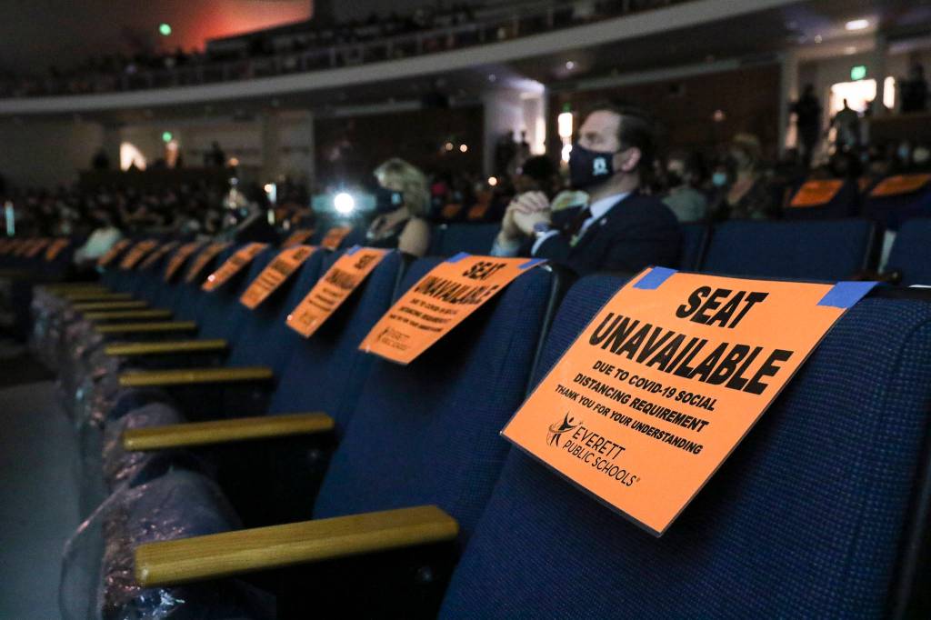 Families and friends sit socially distanced during Sequoia Highs graduation ceremony Thursday in Everett. (Andy Bronson / The Herald)