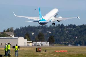The final version of the 737 MAX, the MAX 10, takes off from Renton Airport in Renton, WA on its first flight Friday, June 18, 2021. The plane will fly over Eastern Washington and then land at Boeing Field  (Ellen M. Banner/The Seattle Times via AP, Pool)