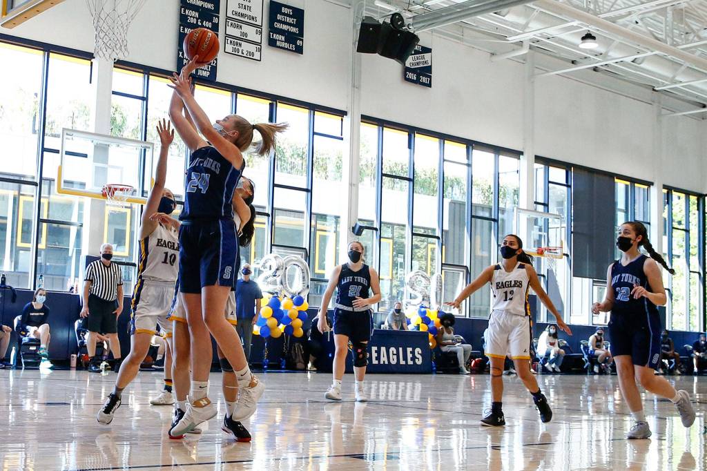 Sultans Faith Anderson attempts a shot Thursday afternoon at Eastside Prep in Kirkland on June 17, 2021. (Kevin Clark / The Herald)