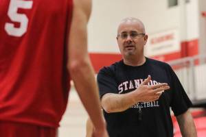 Kevin Clark / The Herald

Zach Ward, head coach of the Stanwood Spartans, runs through the defense for their regional playoff game Wednesday afternoon in Stanwood, Washington on February 24, 2012.