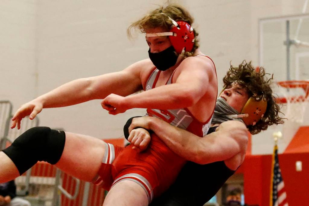 Lake Stevens Isiah Young wrestles Stanwoods Mason Ferguson during a meet at Stanwood High School on May 20. (Kevin Clark / The Herald)
