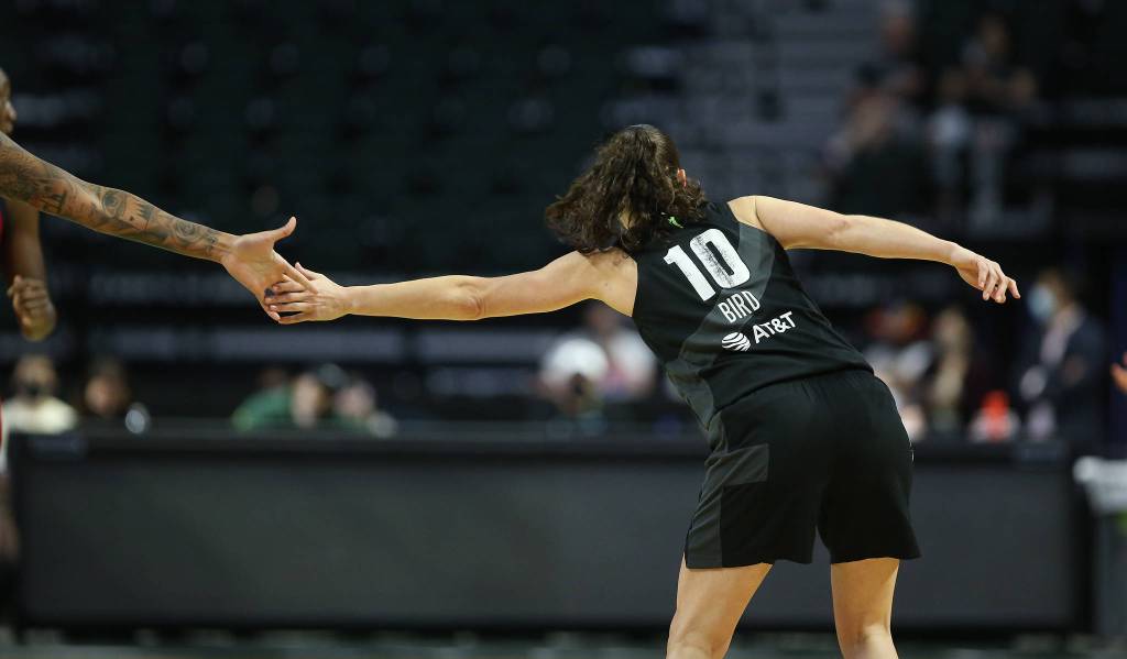 The Storms Sue Bird gets a hands from a teammate after a basket during a game against the Mystics on Tuesday evening at Angel of the Winds Arena in Everett. (Andy Bronson / The Herald)