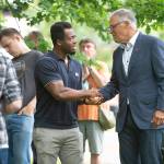 Kwabi Amoah-Foreson of Tacoma greets Washington Gov. Jay Inslee at Wright Park in Tacoma during a celebration of the states reopening on Wednesday. (Tony Overman / The News Tribune via AP)