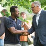 Kwabi Amoah-Foreson of Tacoma thanks Washington Governor Jay Inslee during the "Welcome Back, Washington" celebration at Wright Park in Tacoma, Wash., on Wednesday, June 30, 2021. (Tony Overman/The News Tribune via AP)