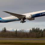 With the Olympic mountains in the background, Boeings 777x lifts off from Paine Field on its first flight, to Boeing Field in Seattle, on Jan. 25, 2020 in Everett. (Andy Bronson / Herald file)