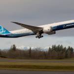 With the Olympic mountains in the background, Boeing's 777x  lifts off from Paine Field on its first flight, to Boeing Field in Seattle, on Saturday, Jan. 25, 2020 in Everett, Wash. (Andy Bronson / The Herald)