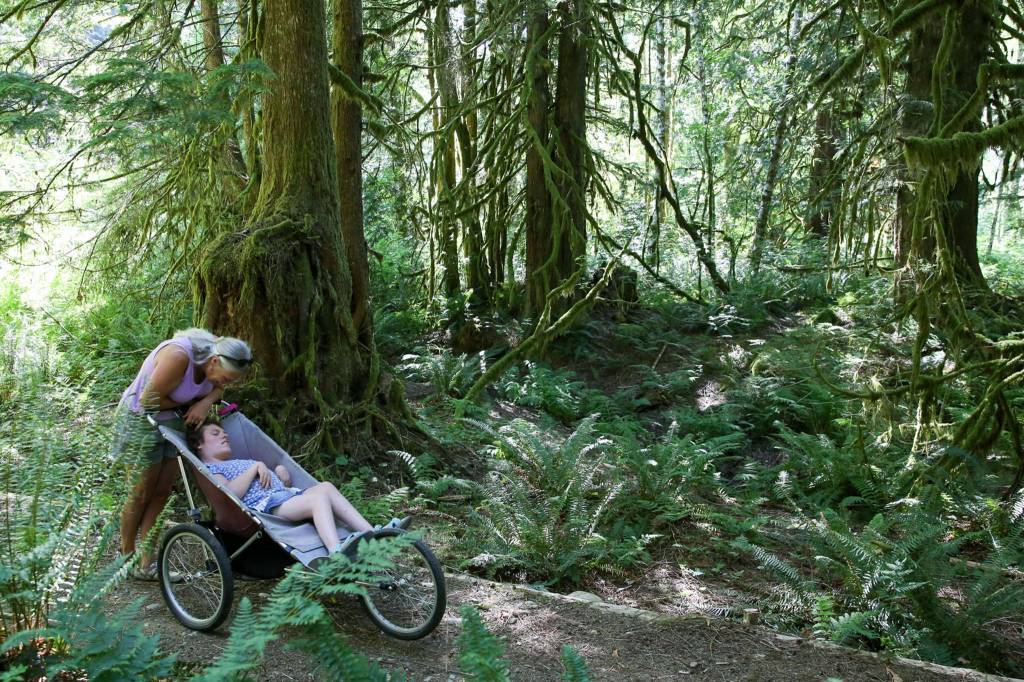 Karen Sample with her daughter, Erin, on Erinswood Trail. (Kevin Clark / The Herald)