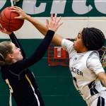 Glacier Peaks Aaliyah Collins blocks the shot of Inglemoors Lucy Young during a game at Jackson High School in Mill Creek on Feb. 18, 2020. (Kevin Clark / The Herald)