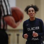 Glacier Peaks Aaliyah Collins laughs while standing at the free-throw line during a game against Snohomish on Dec. 9, 2019 at Snohomish High School. (Andy Bronson / The Herald)