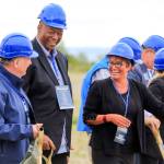 From left: State Rep. Mike Sells, Port of Everett Commissioner David Simpson and Everett Mayor Cassie Franklin share a laugh before the groundbreaking at the ports Norton Terminal, on the former Kimberly-Clark mill site, Thursday in Everett. (Kevin Clark / The Herald)