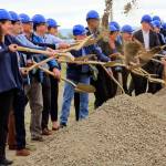 Community leaders and officials break ground at the Port of Everett's Norton Terminal at the former Kimberly-Clark mill site along the waterfront Thursday morning in Everett on July 15, 2021. (Kevin Clark / The Herald)