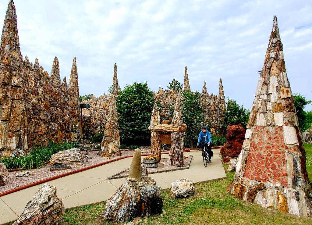 Deven Boyce, 14, of Mukilteo, at Petrified Wood Park in South Dakota during his 3,000-mile cross-country bike ride. He left Mukilteos Lighthouse Park on June 2 and plans to arrive at the Statue of Liberty by the end of July. (Jon Boyce)
