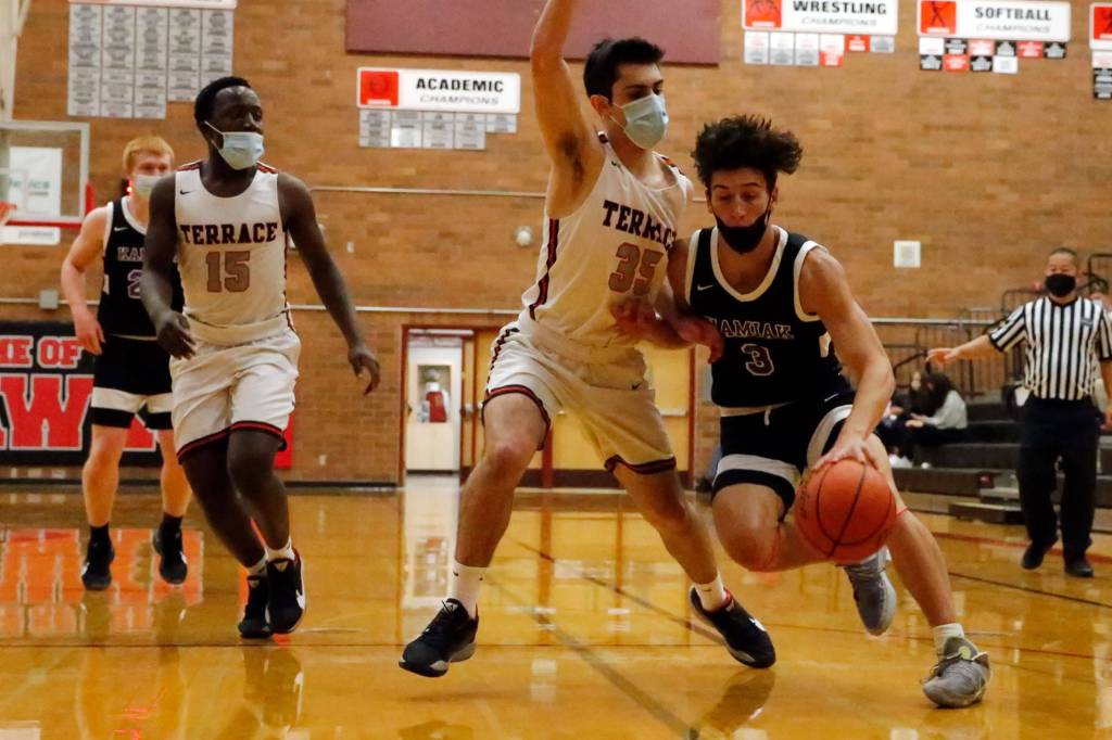 Kamiaks Brendan Beier (right) is a second-team All-Area selection. (Kevin Clark / The Herald)
