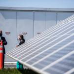 Gov. Jay Inslee walks through Snohomish County PUDs microgrid April 20 in Arlington. (Olivia Vanni / The Herald)
