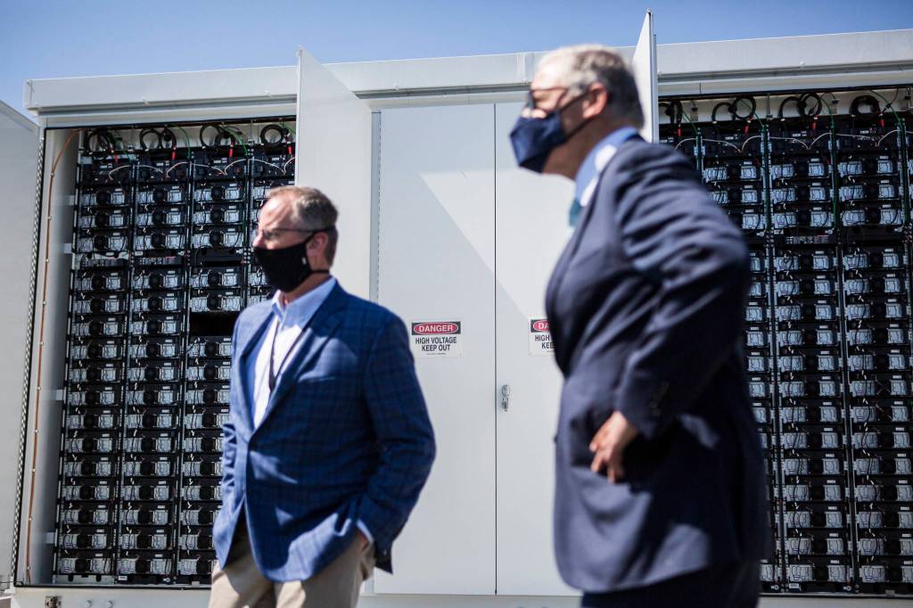 Snohomish County PUDs innovative microgrid batteries, which will store solar power, sit in their enclosed units during a visit by Gov. Jay Inslee. (Olivia Vanni / The Herald)