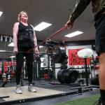 Cindy Buchan works out at Blinn Fitness in Everett on Wednesday. Buchan, 60, recently won a most-inspirational award in a weightlifting competition in Oregon, where she lifted 319 pounds. (Kevin Clark / The Herald)