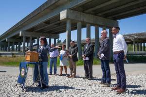 With other officials behind her, u.S. Rep. Suzan DelBene (WA-01) speaks at a press conference underneath the US 2 trestle on Wednesday, June 2, 2021 in Lake Stevens, Washington. The elected officials gathered  to make their case for how an injection of federal funds into the nation’s transportation infrastructure could lead to less congested and safer commutes for Snohomish County residents. (Andy Bronson / The Herald)
