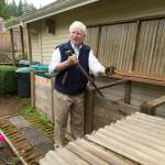 Bill Taylor home shows off his compost bins during a tour of his garden Tuesday in Edmonds. (Andy Bronson / The Herald)