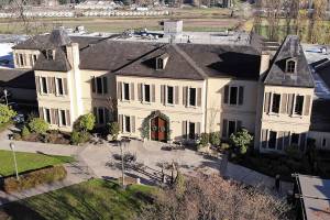 In this photo taken Thursday, Nov. 21, 2019, the French-style inspired main building of the Chateau Ste. Michelle winery is seen in Woodinville, Wash. Washington, which now boasts more than 1,000 wineries in the state, has become a force in the wine industry. Washington is the second-largest producer of premium wines in the United States, trailing only California. (AP Photo/Elaine Thompson)