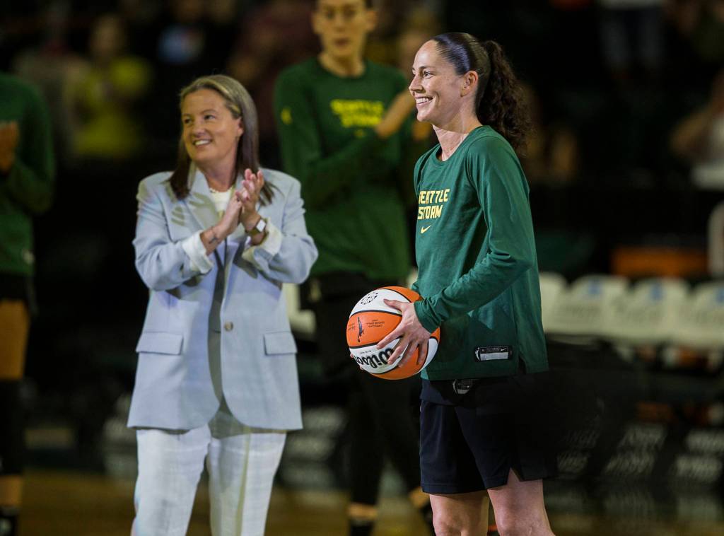 Olivia Vanni / The Herald 
Seattle Storms Sue Bird receives a basketball Sunday in Everett honoring her achievement of becoming the only player in league history to amass 3,000 career assists.