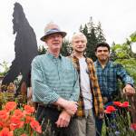 Joseph Lindell (left), his son Nathaniel, 19 (center), and Jason Guzman, 18, stand next to the Bigfoot cutout on Beverly Lane in Everett. Nathaniel made several Bigfoot cutouts during the pandemic to stay busy. He and Guzman, both 2021 Cascade High School graduates, leave in September on the U.S. Marine Corps buddy program. (Olivia Vanni / The Herald)