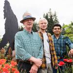 Joseph Lindell, left, Nathaniel Lindell, 19 and Jason Guzman, 18, next to one of Nathaniel's Bigfoot cutout on Friday, July 16, 2021 in Everett, Wash. (Olivia Vanni / The Herald)