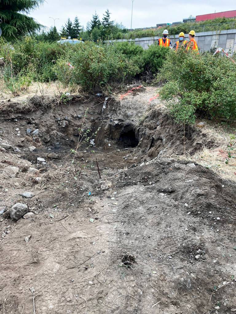 A view of the hole where workers were clearing dirt to get better access for a camera to inspect the tunnel. (Everett Fire Department)