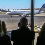 The first flight for United Airlines servicing Paine Field taxis to the gate on March 31, 2019. (Kevin Clark / Herald file)