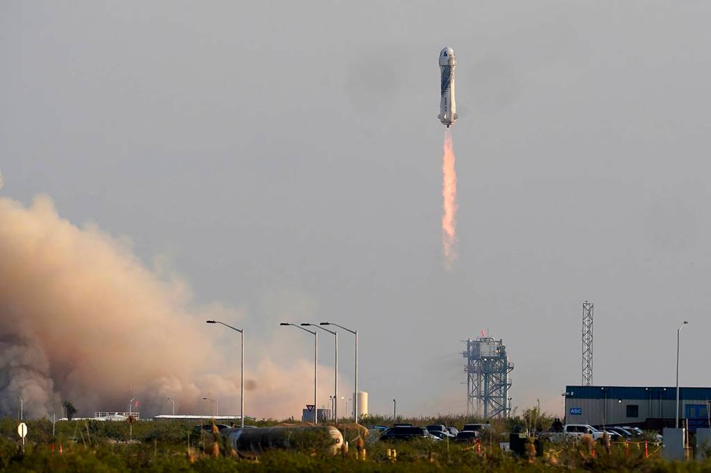 Blue Origins New Shepard rocket launches carrying Jeff Bezos, his brother Mark Bezos, Oliver Daemen and Wally Funk from its spaceport near Van Horn, Texas on Tuesday. (AP Photo/Tony Gutierrez)