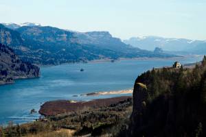 FILE--In this July 19, 2010, file photo, the Columbia River Gorge and Crown Point, at right, are visible from Chanticleer Point near Corbett, Ore. The fast-moving wildfire chewing through Oregon's Columbia River Gorge is threatening more than homes and people. It's also devouring the heart of the state's nature-loving identity.(AP Photo/Don Ryan, file)