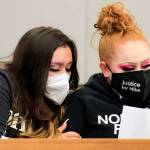 Nevaeh Smith (left), niece of murder victim Michael Smith, and Shuston Smith, Michael Smiths sister, embrace at the sentencing of Jesse Engerseth Tuesday at the Snohomish County Courthouse in Everett. (Kevin Clark / The Herald)