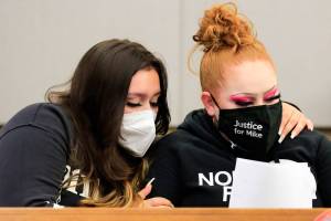 Nevaeh Smith (left), niece of murder victim Michael Smith, and Shuston Smith, Michael Smith's sister, embrace at the sentencing of Jesse Engerseth Tuesday afternoon at the Snohomish County Superior Courthouse on July 27, 2021. (Kevin Clark / The Herald)