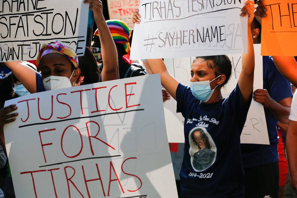 Family and friends of Tirhas Tesfastion and their supporters gather during a rally Monday at Lynnwood City Hall. (Kevin Clark / The Herald)