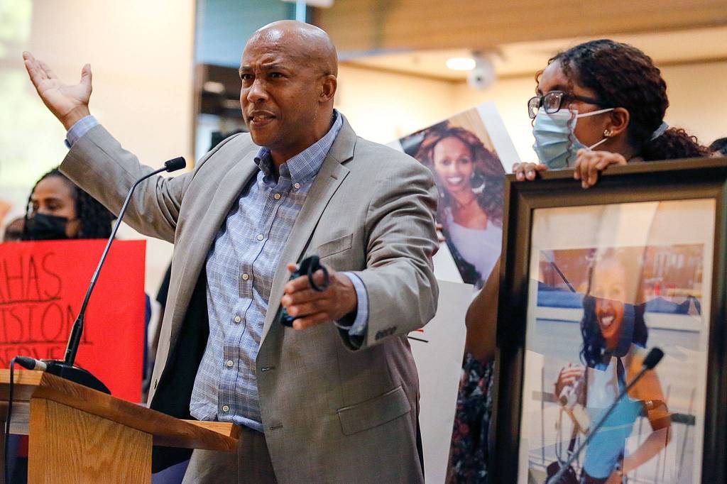 Attorney James Bible addresses the City Council during a rally Monday at Lynnwood City Hall. (Kevin Clark / The Herald)