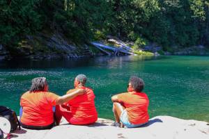 Family and friends gather at the waters of the Skykomish River at Eagle Falls in memorial of Devin Shelby Thursday afternoon Index on July 29, 2021. Devin Shelby drowned at Eagle Falls and his body has not been recovered. (Kevin Clark / The Herald)