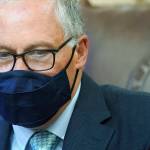 A masked Gov. Jay Inslee is seen May 12 at the Capitol in Olympia. The governor is now asking everyone  vaccinated or not  to consider wearing a mask in crowded indoor settings. (AP Photo/Ted S. Warren, file)