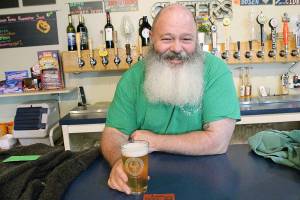 Terry Boese, owner of Wicked Teuton Brewing Company, says he wishes his beard was longer so he could dress up as a wizard for a Harry Potter trivia night happening later this month. The brewer and the library are teaming up to offer two Booktoberfest trivia events, starting Thursday. Photo by Laura Guido/Whidbey News-Times