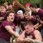 Lakewood High School football players cheer on their lineman during the Cougars Championship Lineman Challenge at Lakewood High School on July 31 in Arlington. (Olivia Vanni / The Herald)